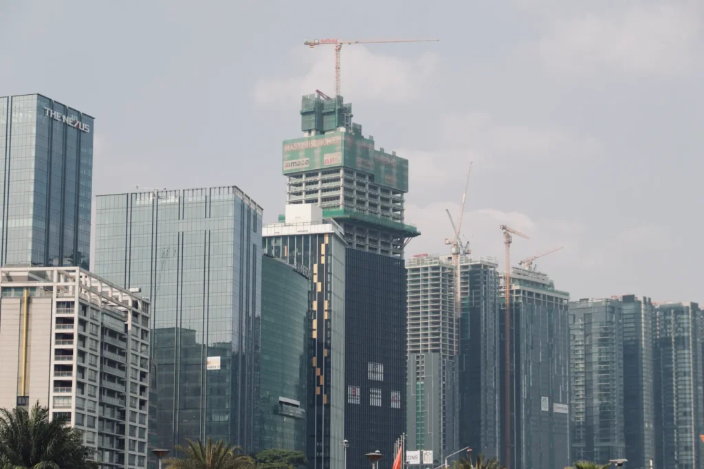 Construction cranes over high-rise buildings